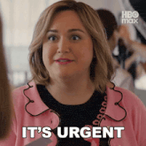 a woman says it 's urgent in a pink jacket