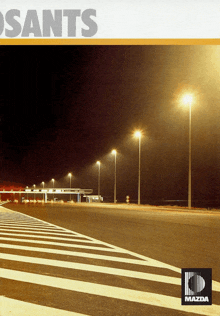 an advertisement for mazda shows a zebra crossing