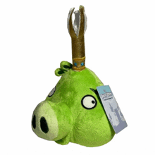 a green angry birds stuffed animal with a tag on it