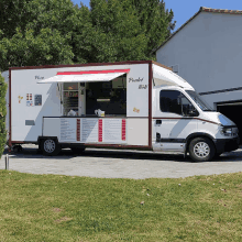 a white and red food truck that says poulet roti