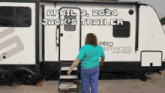 a woman standing in front of a trailer that says pro services