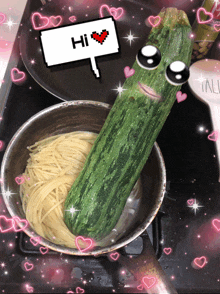 a picture of spaghetti and a zucchini that says hi on it