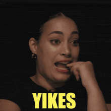 a woman is making a face and the word yikes is on her face