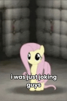 a cartoon pony is sitting in a room with the words `` i was just joking guys '' written on it .