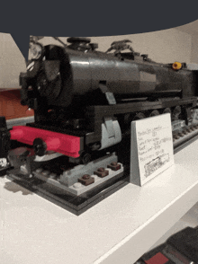 a lego model of a train with a sign that says ' montreal spa locomotive '