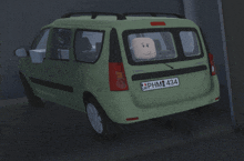 a green van with a license plate that says phm434