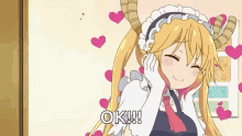 a cartoon girl with horns is surrounded by hearts and says `` ok ! ''