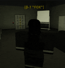 a person standing in a dark room with a sign that says " b-7 " fox "