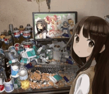 a girl is standing in front of a messy desk with a computer monitor that says neet-chan on it