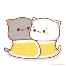 two cats are hugging each other and wrapped in a blanket .