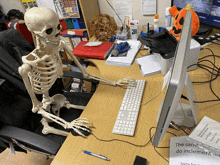 a skeleton sits at a desk with a sign that says the same do inclement