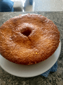 a cake on a white plate with a hole in it