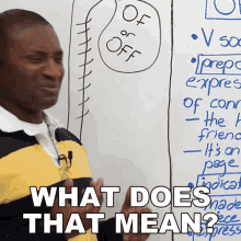 a man stands in front of a white board with the words what does that mean on it