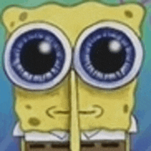 a close up of spongebob squarepants ' face with big blue eyes .