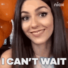 victoria justice is smiling and says " i can 't wait " in front of orange balloons