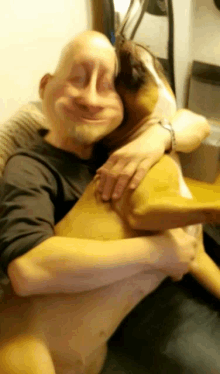 a man is hugging a dog with a strange face on his face