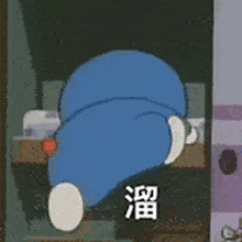 a cartoon character is laying on the floor with chinese writing on it .