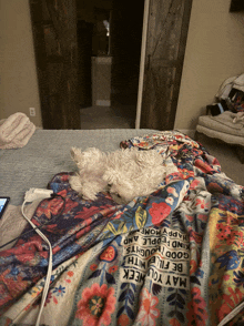 a dog laying on a bed with a blanket that says may you week on it