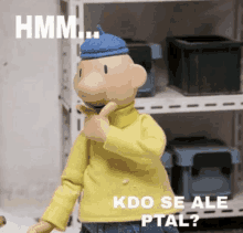 a cartoon character is standing in front of a shelf and says hmm kdo se ale ptal ?