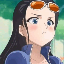 a close up of a cartoon girl wearing sunglasses making a funny face .