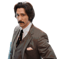 a man with a mustache is wearing a suit and tie with a pocket square that says ' a ' on it