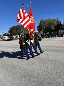 a group of soldiers marching down a street holding flags