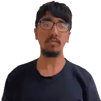 a man with glasses and a beard looks to the side