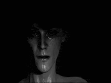 a close up of a person 's face in a black and white photo with their eyes open .