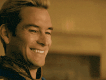 a man is smiling with his eyes closed and his mouth open
