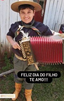 a young boy is holding an accordion and smiling for the camera