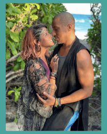 a man and a woman are standing next to each other and looking at each other