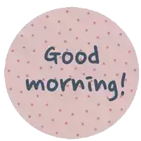 a pink circle with polka dots and the words good morning on it