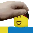 a person is putting a towel on the head of a yellow lego man .