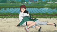 a cartoon of a man laying on the ground while a woman holds him