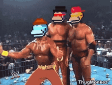 a group of wrestlers are standing in a ring with pixelated faces on their heads