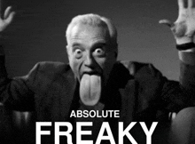 a black and white photo of a man sticking out his tongue with the words absolute freaky behind him