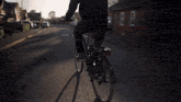 a man riding a bike with a basket on the front