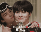 two young men hugging each other with the words " riri y matti " written above them