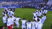 a group of soccer players are dancing on a field with the words argentina campione de america on the bottom