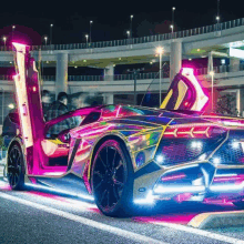 a colorful car is parked in a parking lot with its door open