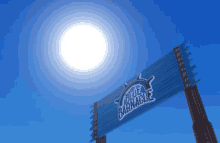 the sun is shining brightly behind a sign for the blue barnnacle