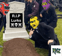 a group of people standing around a grave with a sign that says r.i.p lurks on it