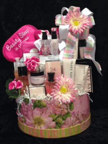 a gift basket with mary kay products and a sleep mask