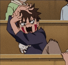 a cartoon character is sitting in a classroom with a cat on his lap and making a funny face .