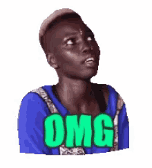 a man in a blue shirt is looking up with the word omg on his chest .