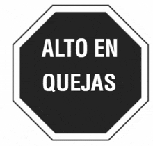 a black octagon sign that says alto en quejas on it