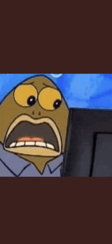 a cartoon character from spongebob squarepants is looking at a computer screen with a surprised look on his face .