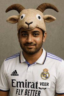 a man wearing an emirates fly better shirt