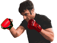 a man wearing a black shirt and red boxing gloves with the word king on them