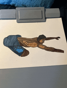 a clipboard with a drawing of a man laying down on it